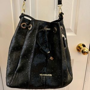 Womens black Michael Kors shoulder bag.